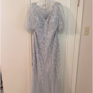 The dress is a silvery blue.